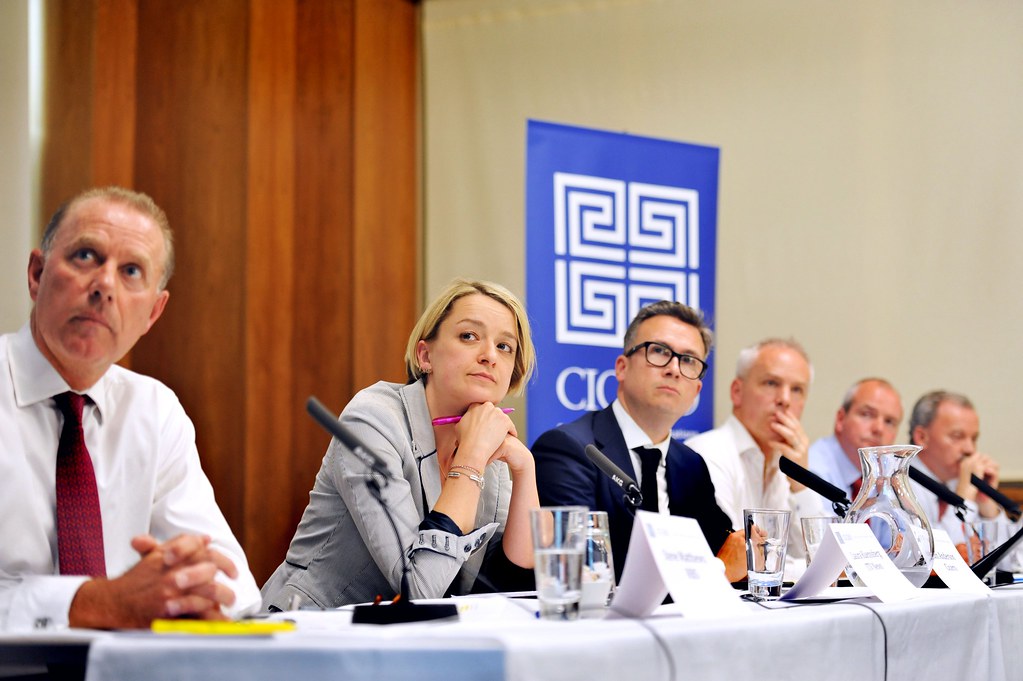 Panel discussion with speakers on stage.