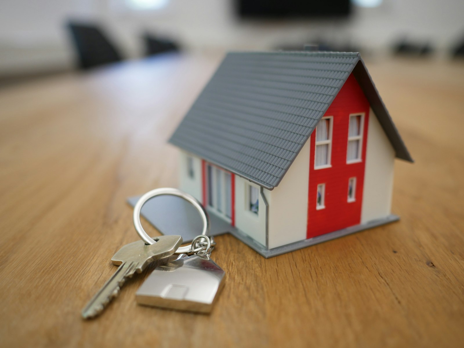 Residential homes and a modern commercial building representing real estate investment types